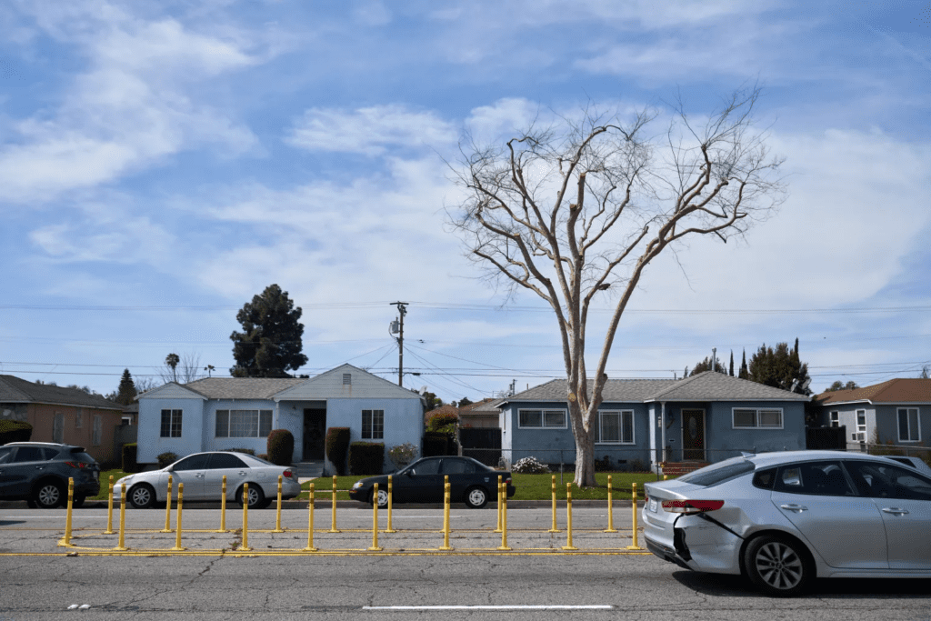 Residents want more than the yellow protective posts erected since Olivares, a pedestrian, was fatally struck by a car fleeing an illegal street race. They want reduced lanes, lower speed limits, and safety islands.